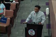 Person Behind Podium for Invocation